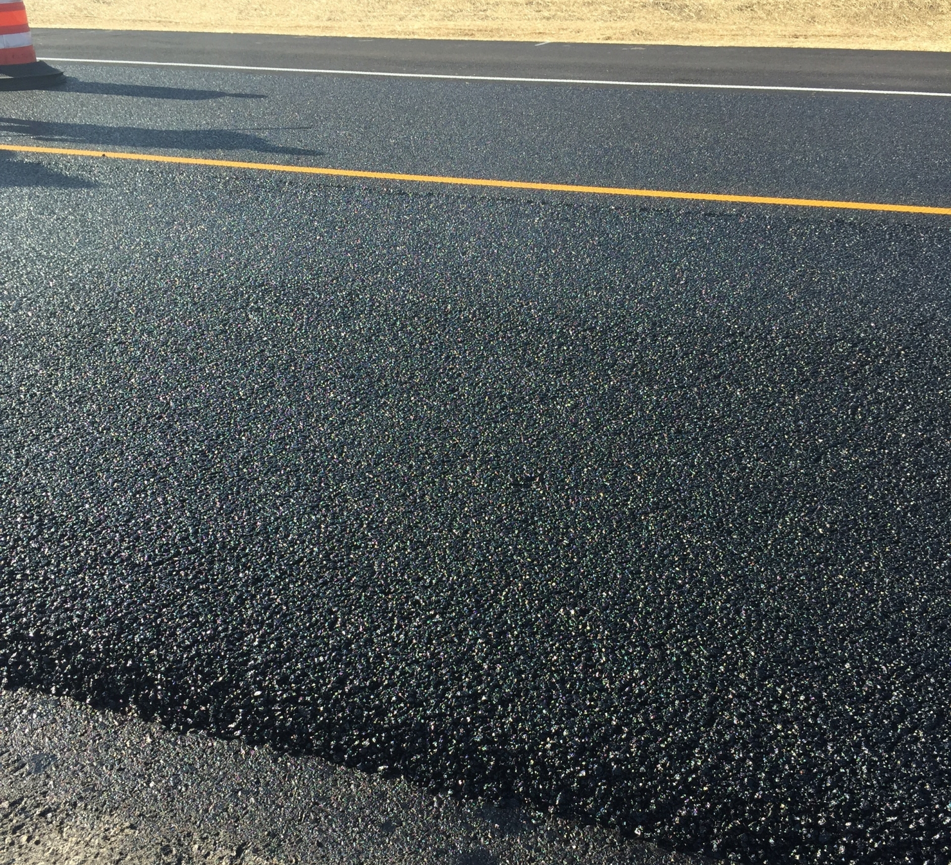 Dry process rubberized asphalt being placed