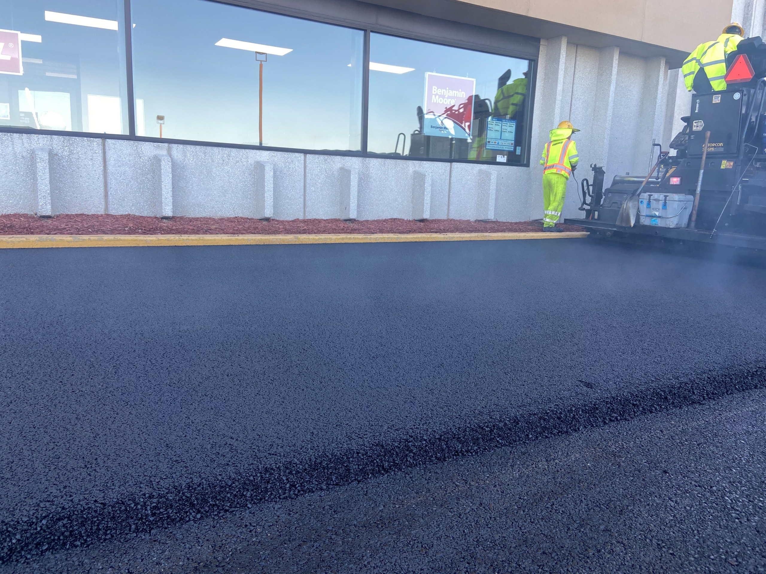 Dry process rubberized asphalt being placed